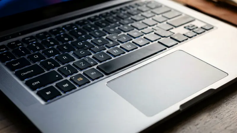 Close up of laptop keyboard and trackpad surface